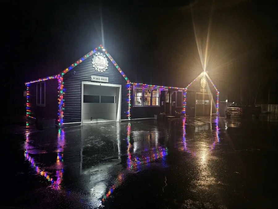 Rattenbury's Auto Works shop lit up at night